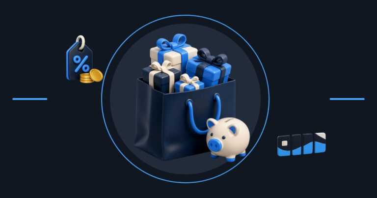 Holiday marketing for small business: a shopping bag full of gifts next to a piggy bank, a discount tag with coins and payment cards